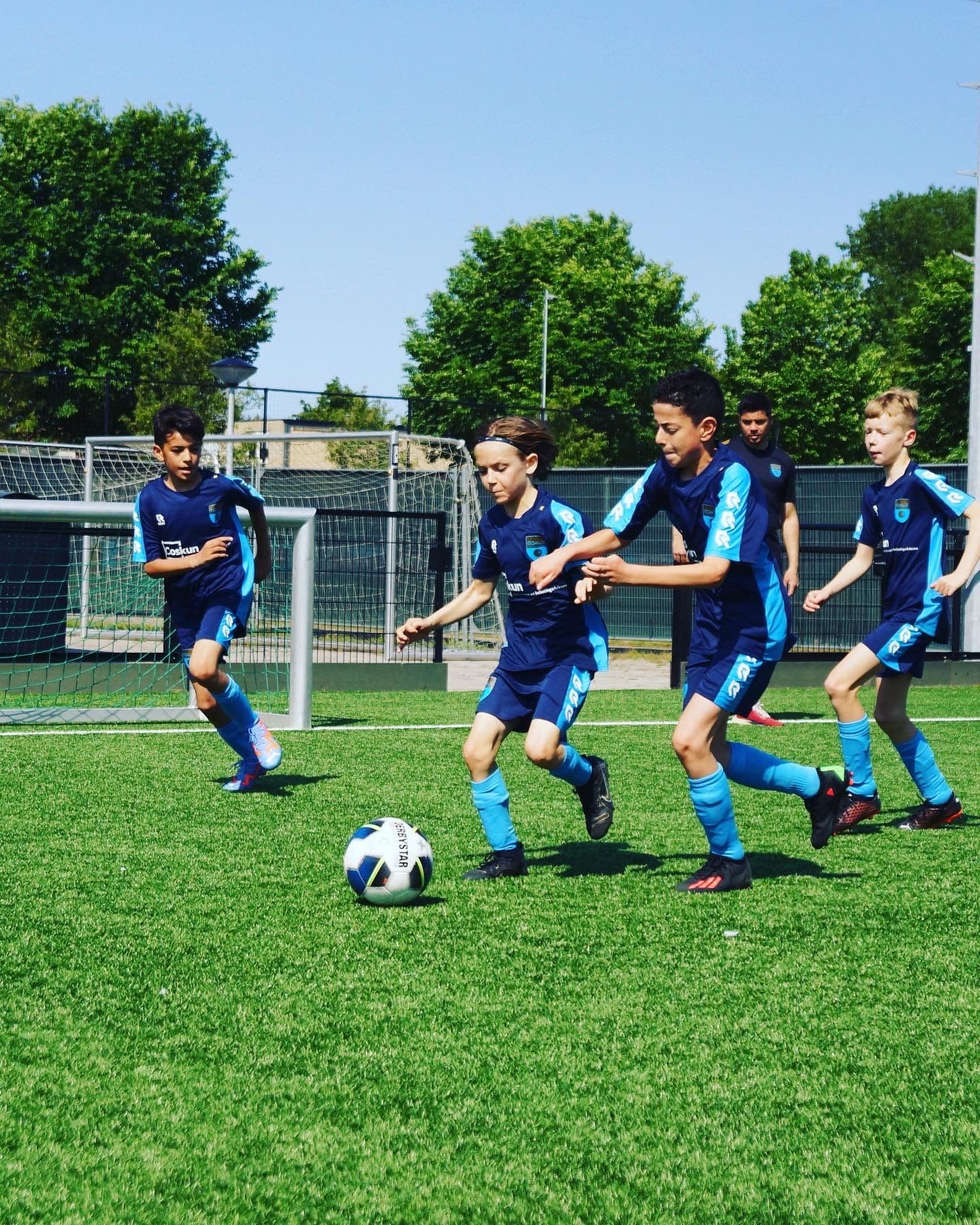 Multiple boys playing football